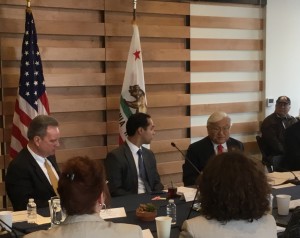 Congressman Mike Honda discusses with HUD Secretary Julian Castro and County Supervisor Board President Dave Cortese the legislative difficulties in supporting homeless housing efforts, while one of Onizuka Crossing's new homeless veteran residents looks on.